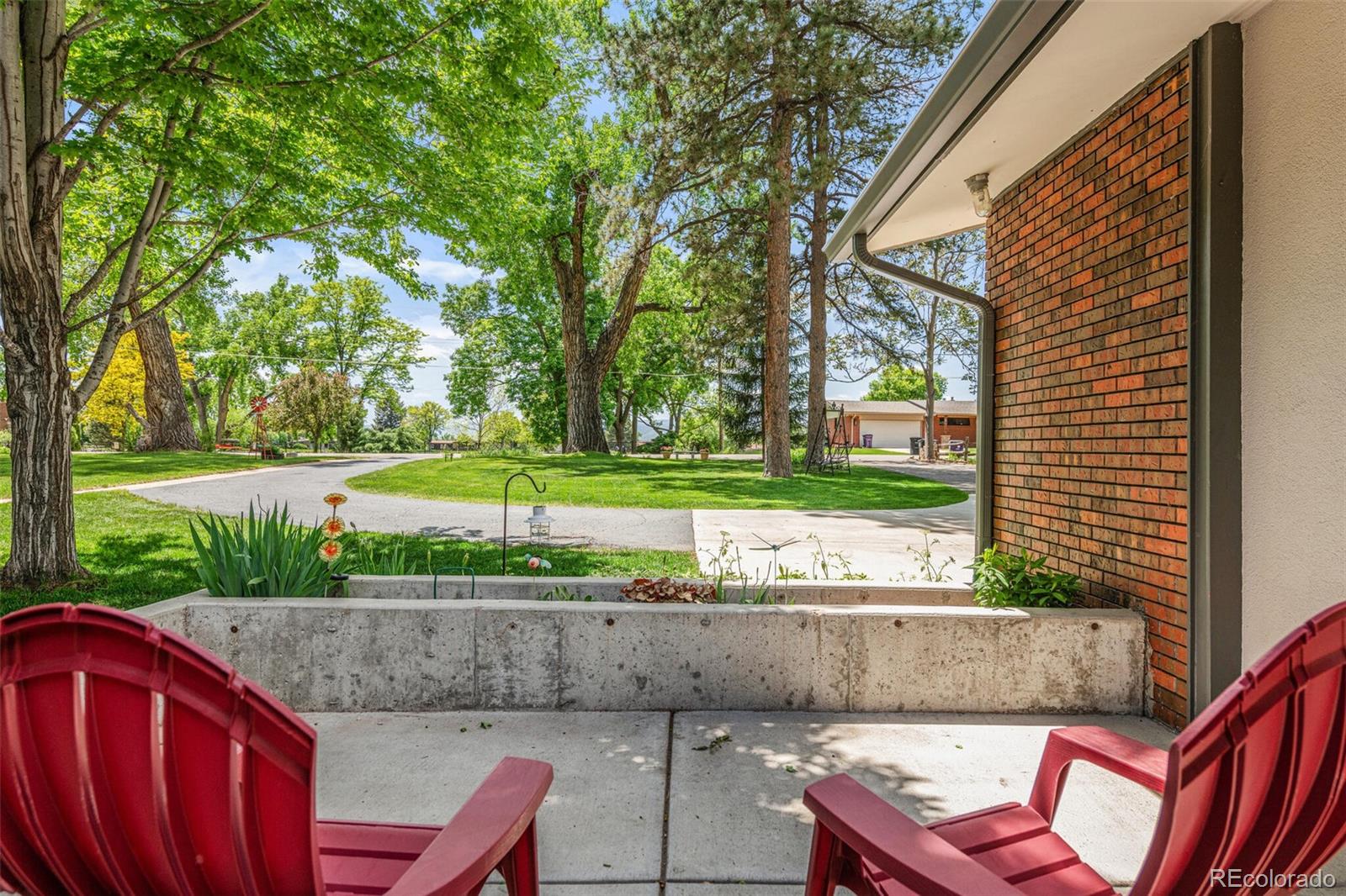 4595 West Lakeridge Road Denver, CO 80219 - Photo 4 of 45 a view of yard with outdoor seating and green space
