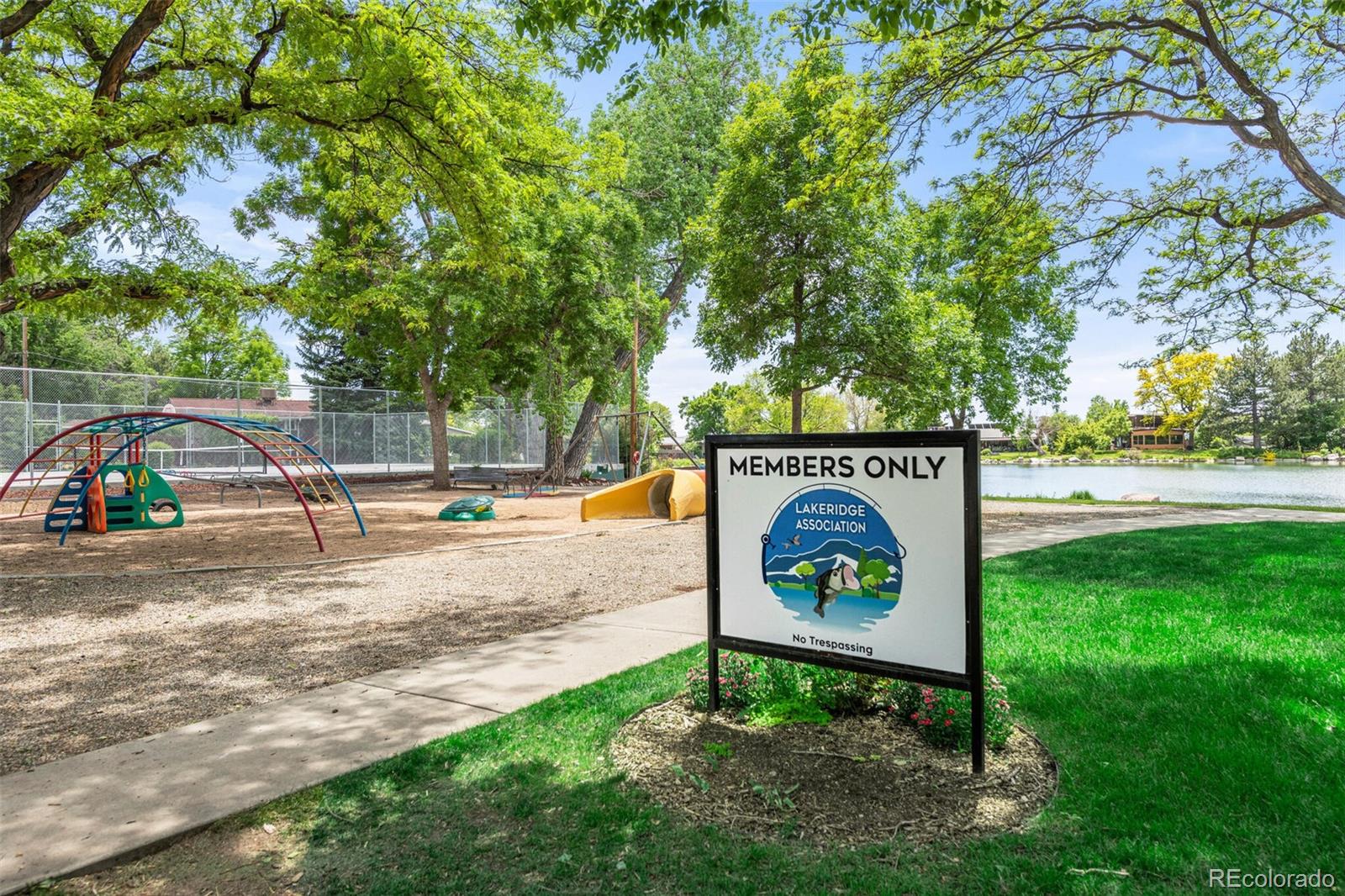 4595 West Lakeridge Road Denver, CO 80219 - Photo 42 of 45 a view of a park that has a sign board large trees