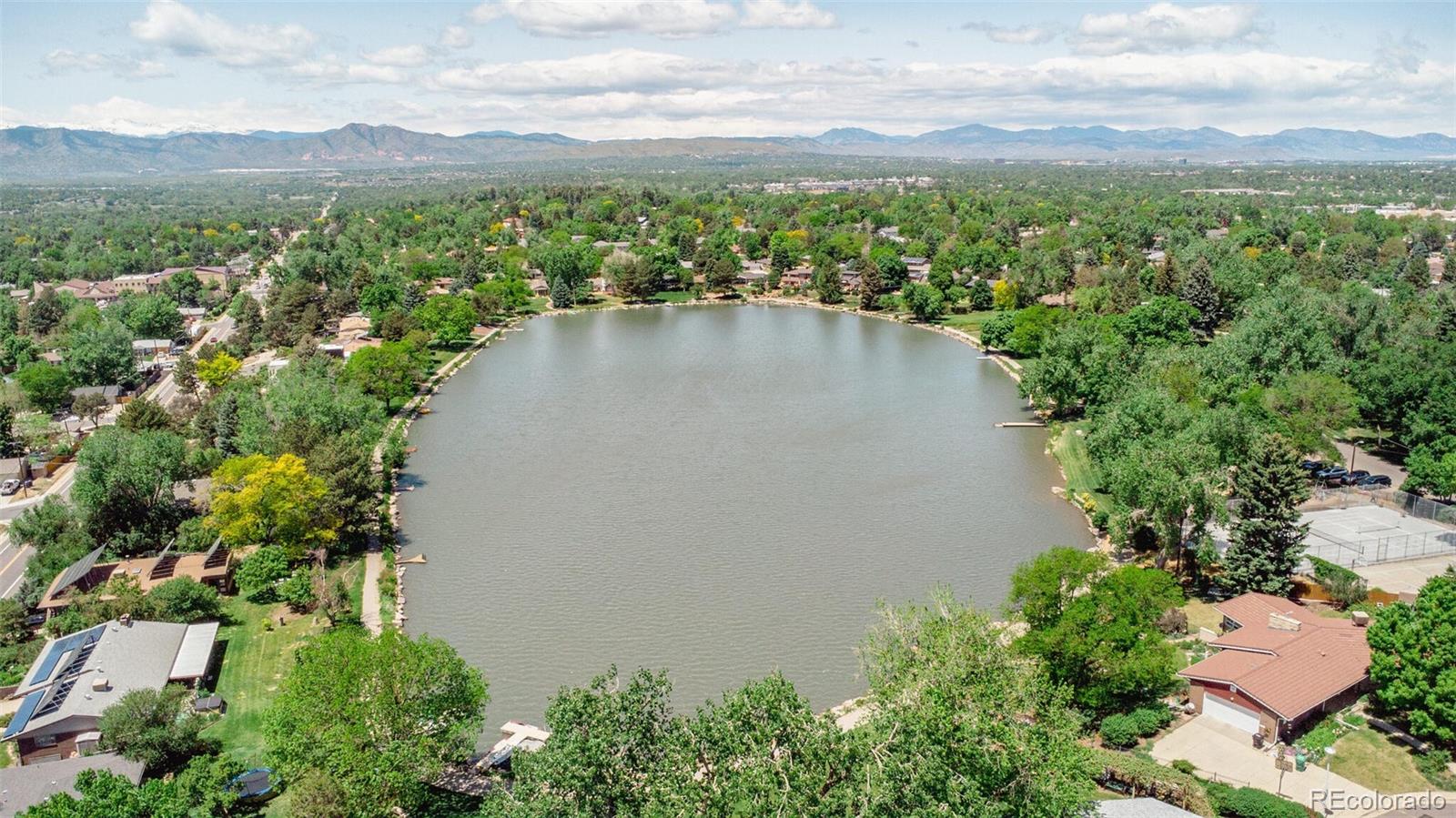 4595 West Lakeridge Road Denver, CO 80219 - Photo 45 of 45 an aerial view of a houses with a yard and lake view