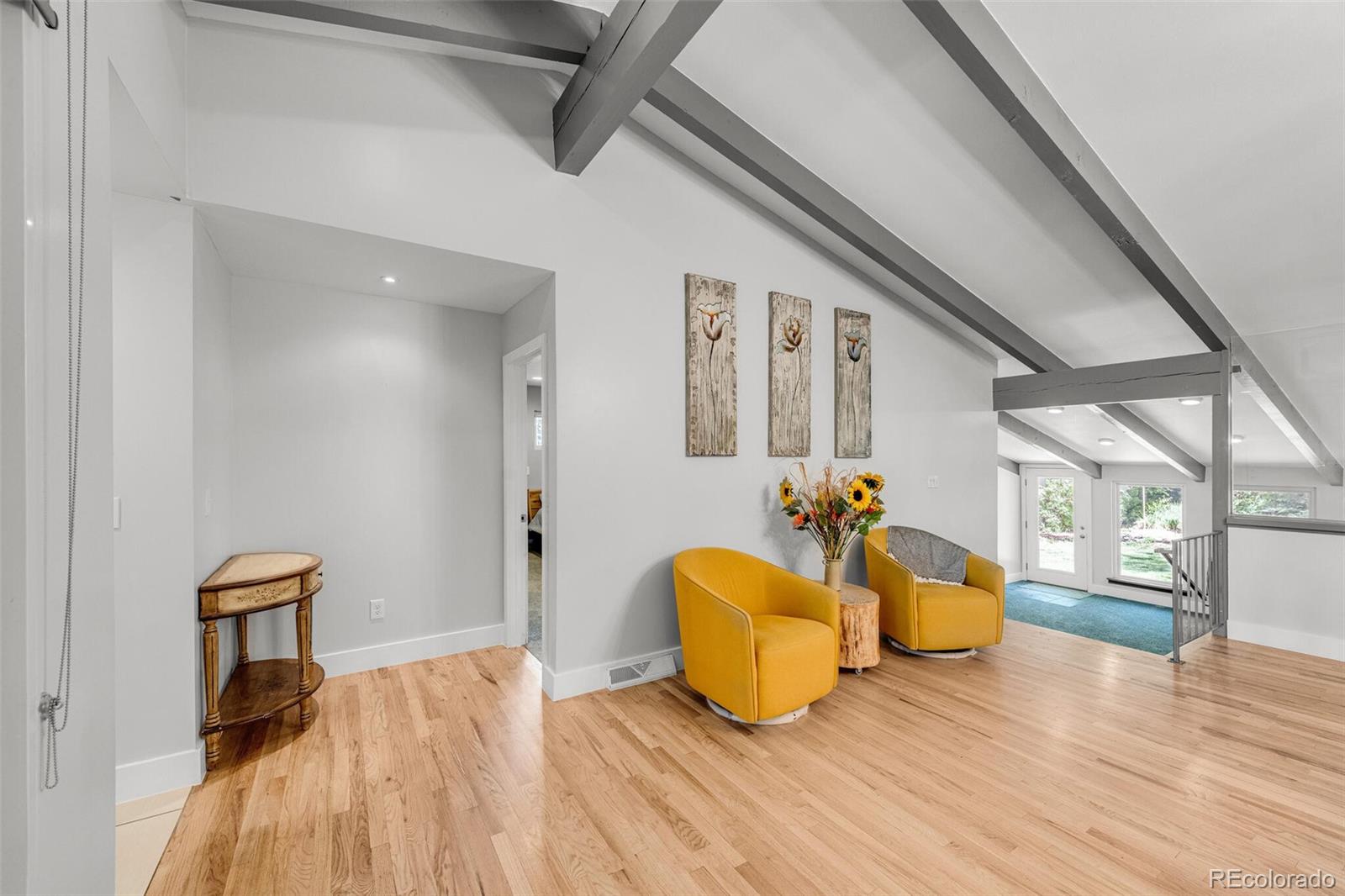 4595 West Lakeridge Road Denver, CO 80219 - Photo 6 of 45 a living room with furniture and a wooden floor