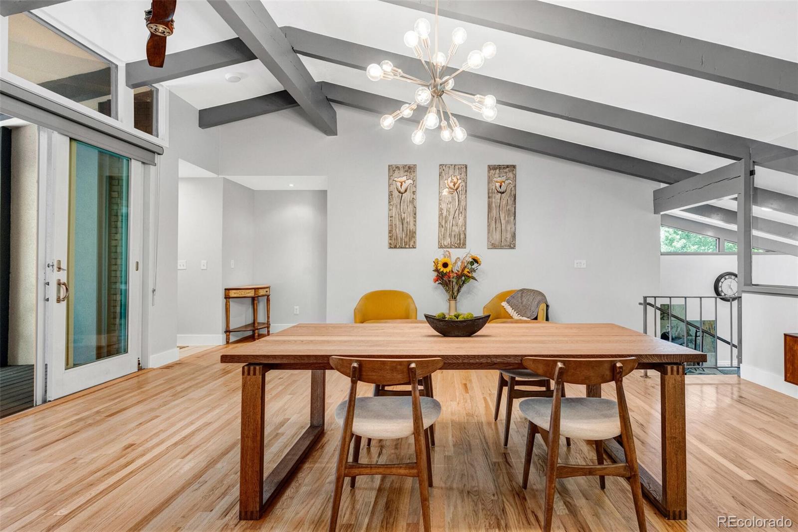 4595 West Lakeridge Road Denver, CO 80219 - Photo 8 of 45 a view of a dining room with furniture and wooden floor