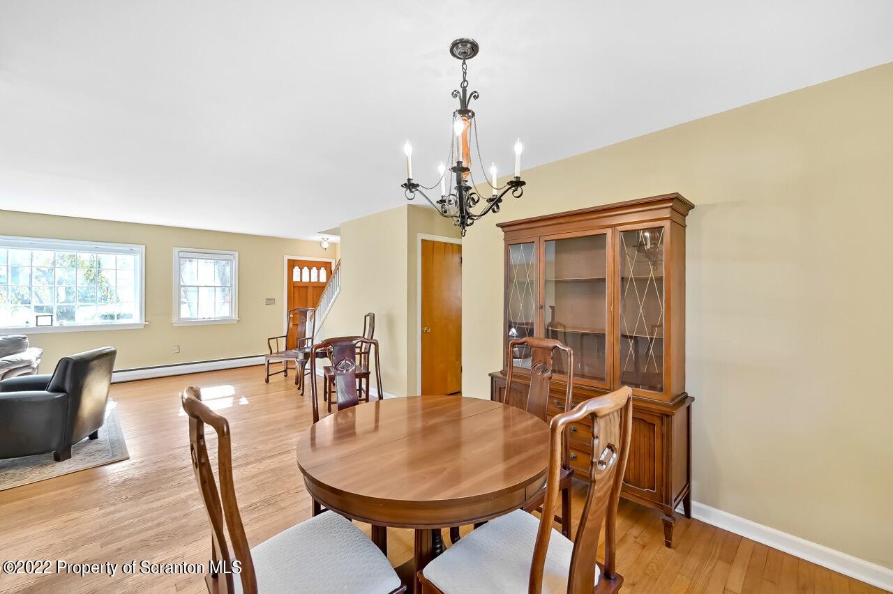 104 Fern Lane Moscow, PA 18444 - Photo 12 of 44 a dining room with furniture and window