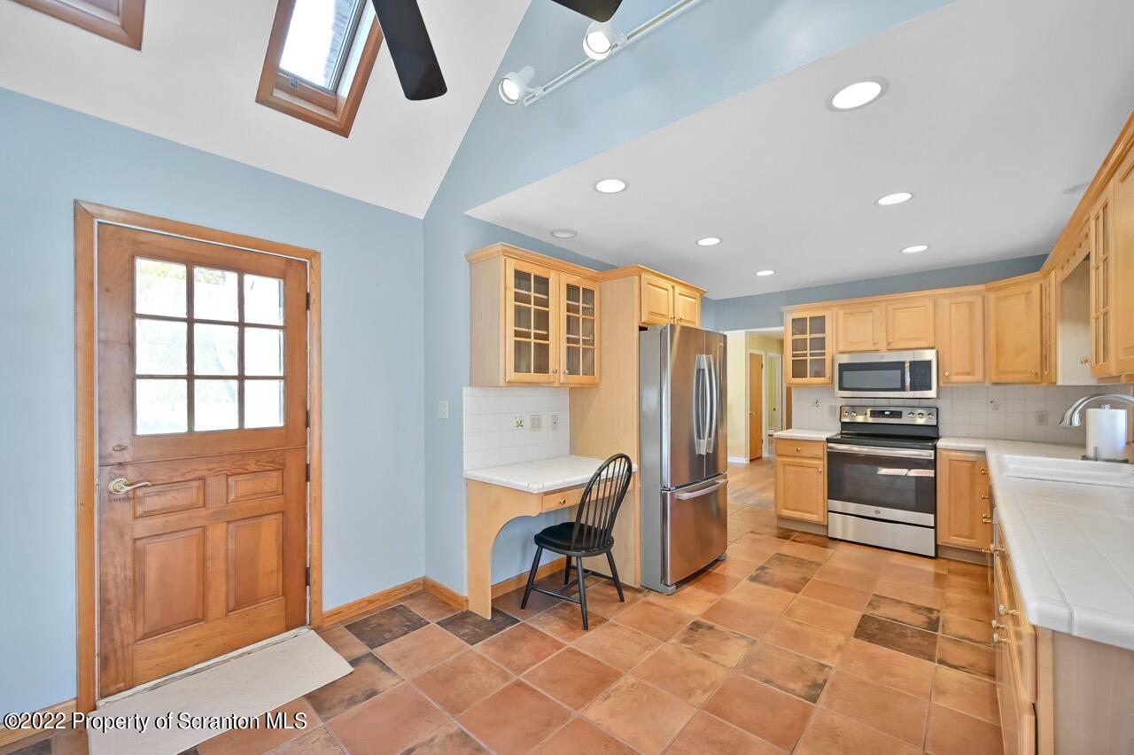 104 Fern Lane Moscow, PA 18444 - Photo 14 of 44 a living room with stainless steel appliances furniture and a kitchen view