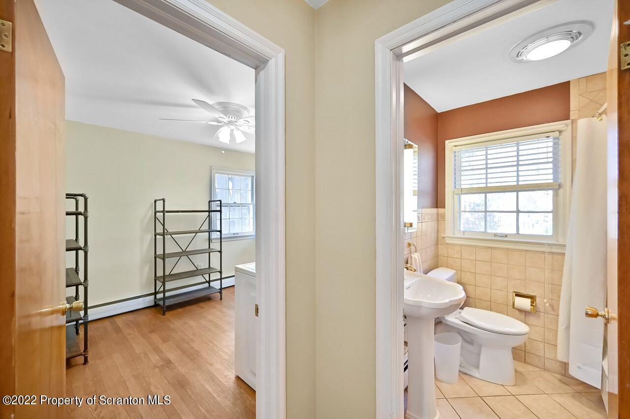 104 Fern Lane Moscow, PA 18444 - Photo 20 of 44 a bathroom with a toilet sink and a shower