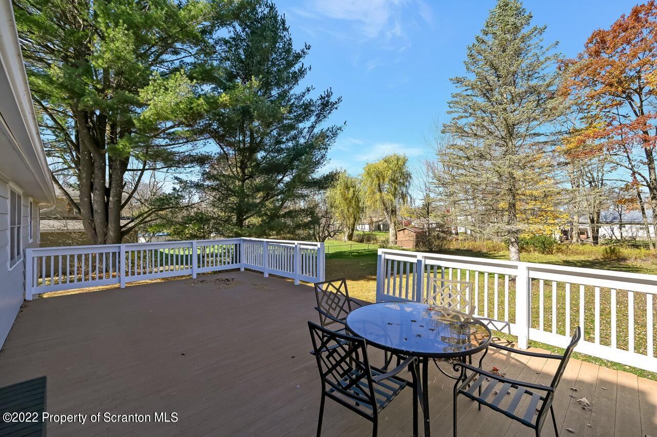 104 Fern Lane Moscow, PA 18444 - Photo 25 of 44 a view of a patio with a table and chairs