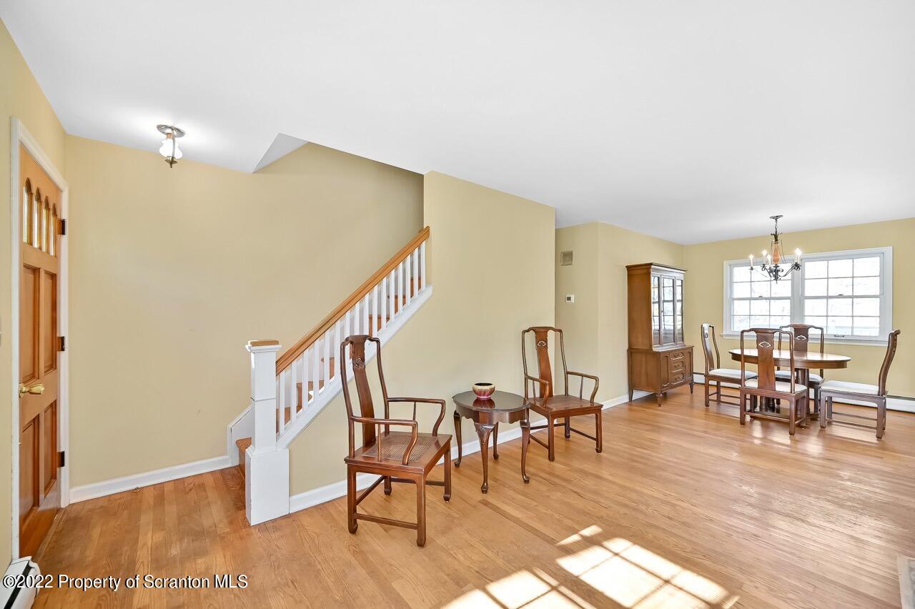 104 Fern Lane Moscow, PA 18444 - Photo 8 of 44 a view of a livingroom with furniture wooden floor and windows