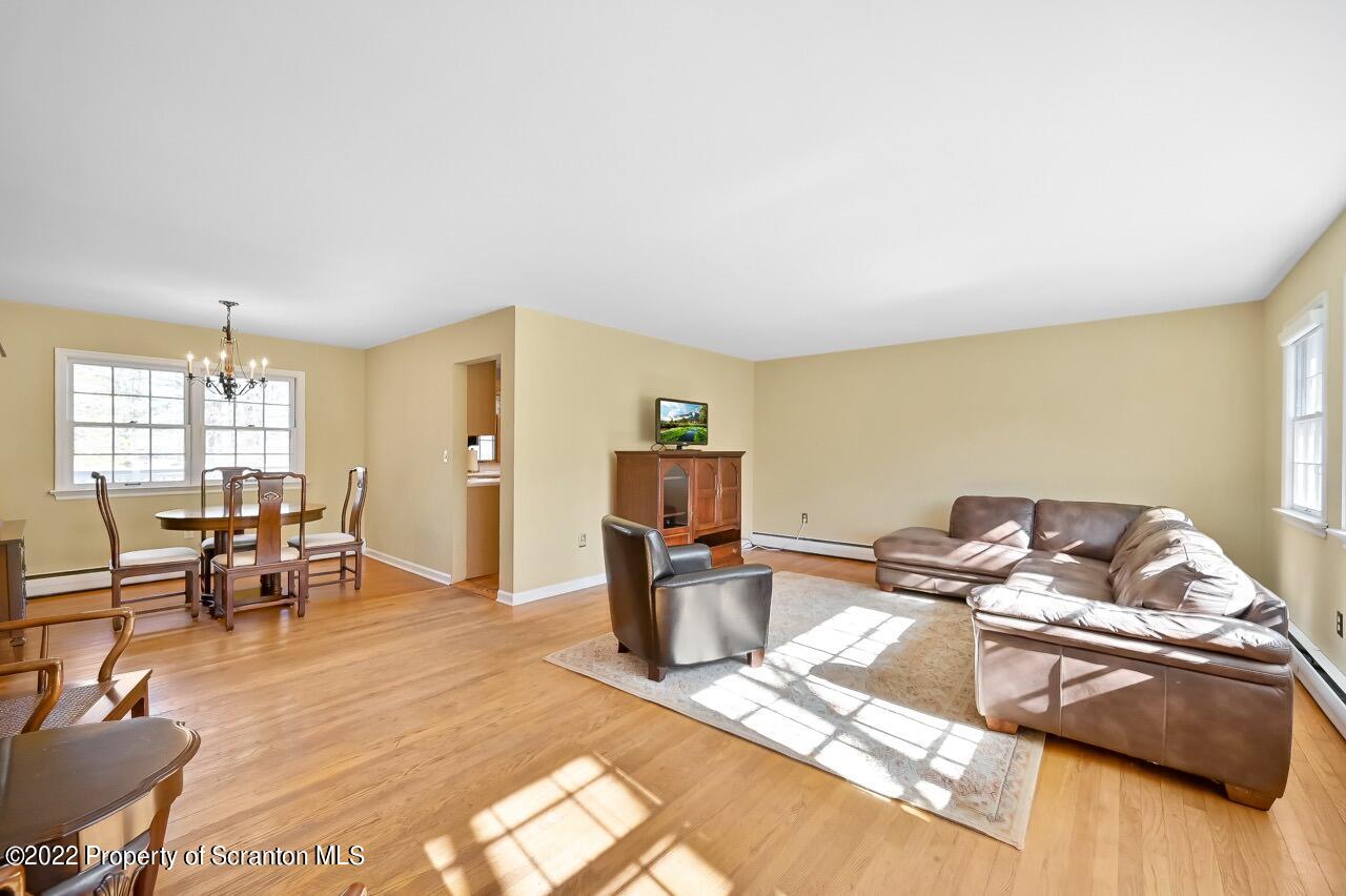 104 Fern Lane Moscow, PA 18444 - Photo 9 of 44 a living room with furniture and a wooden floor