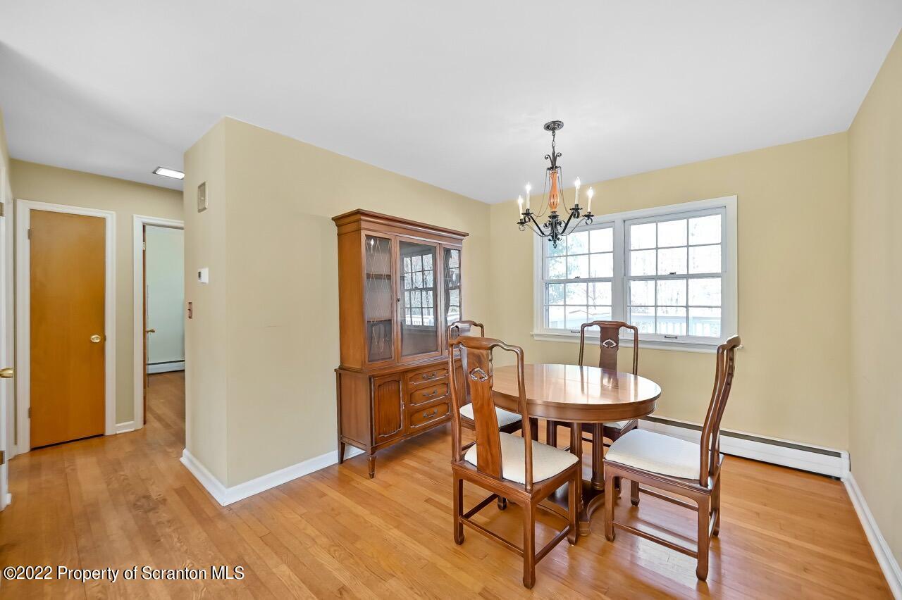 104 Fern Lane Moscow, PA 18444 - Photo 10 of 44 a dining room with furniture and window