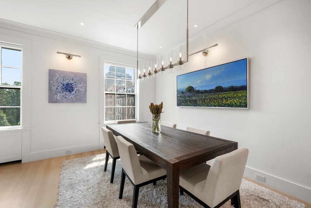 94 Beacon Street, Unit 4 Boston, MA 02108 - Photo 15 of 35 a view of a dining room with a table and chairs