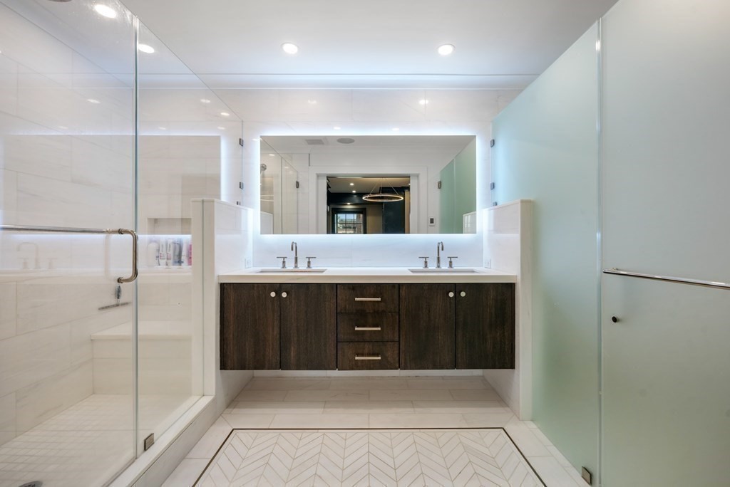94 Beacon Street, Unit 4 Boston, MA 02108 - Photo 20 of 35 a bathroom with a double vanity sink shower and a mirror