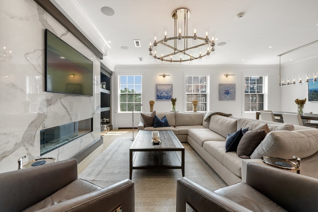 94 Beacon Street, Unit 4 Boston, MA 02108 - Photo 2 of 35 a living room with furniture a chandelier and fireplace