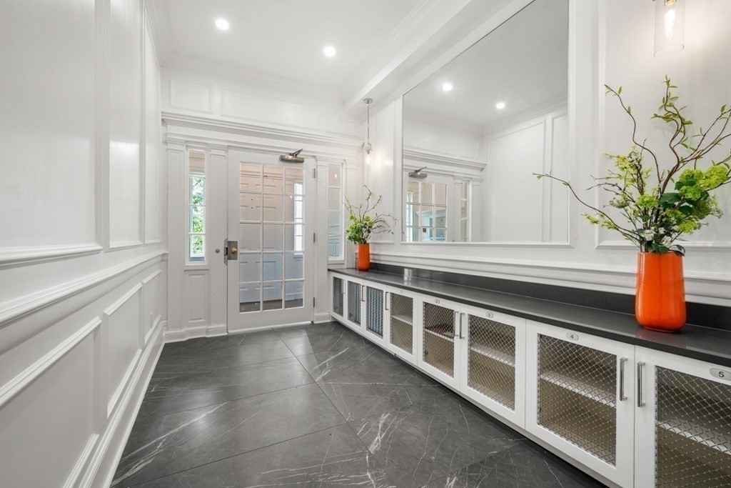 94 Beacon Street, Unit 4 Boston, MA 02108 - Photo 27 of 35 a view of an entryway with wooden floor and windows