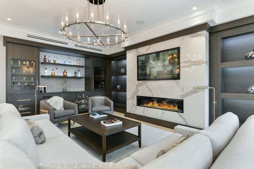 94 Beacon Street, Unit 4 Boston, MA 02108 - Photo 6 of 35 a living room with furniture a fireplace and a chandelier