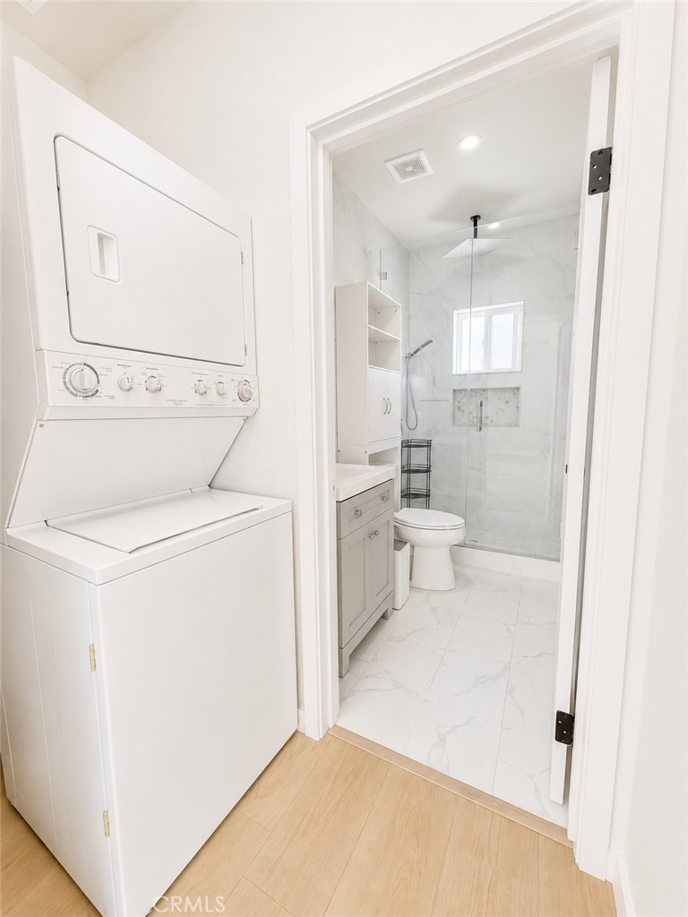 18924 Vose Street Reseda, CA 91335 - Photo 7 of 8 a bathroom with a sink a toilet and shower