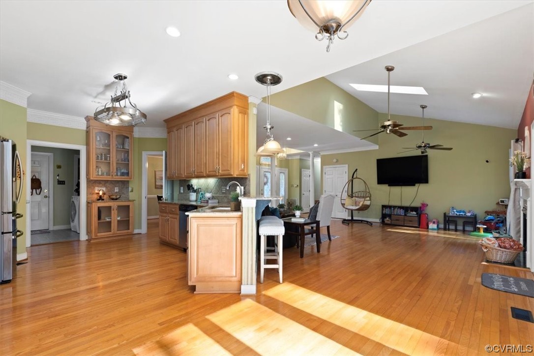 10600 Spring Run Road Chesterfield, VA 23832 - Photo 16 of 49 a view of a dining room and livingroom with furniture wooden floor a chandelier
