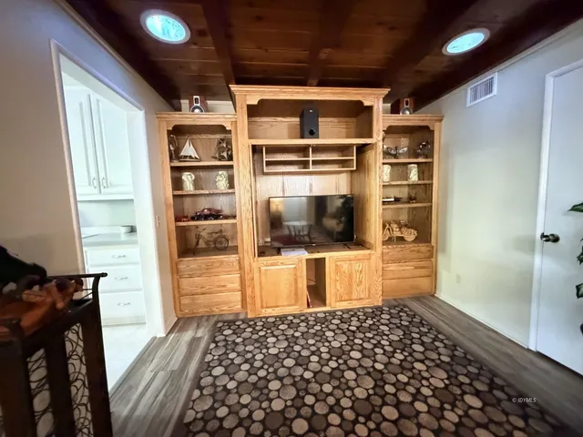 a bedroom with a bed and a walk in closet