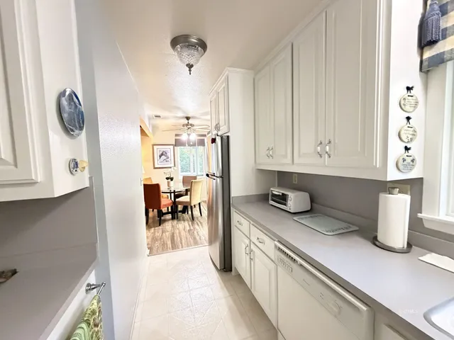 a kitchen with a sink and a stove top oven
