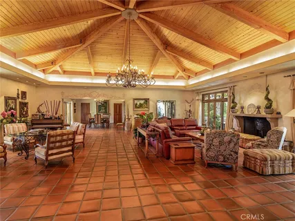 a view of a room with wooden floors