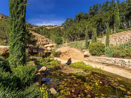 a view of a swimming pool with some trees