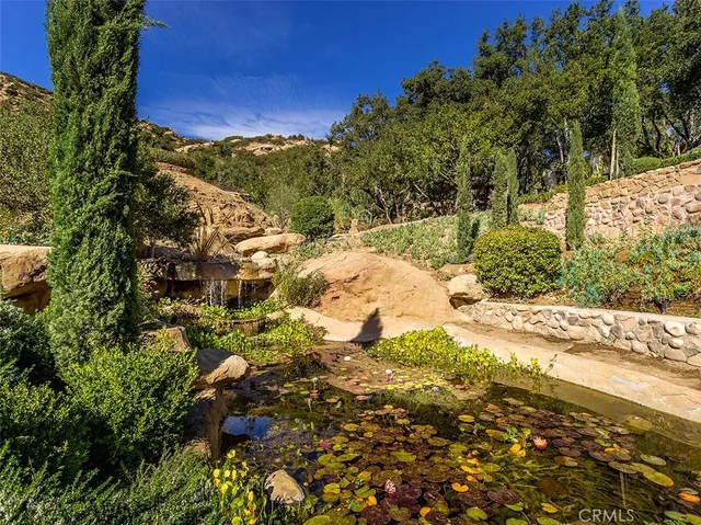 a view of a swimming pool with some trees