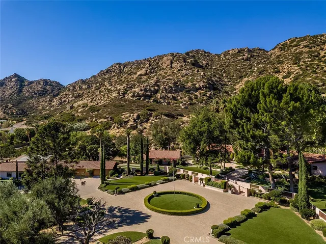 a view of a swimming pool with a table and chairs