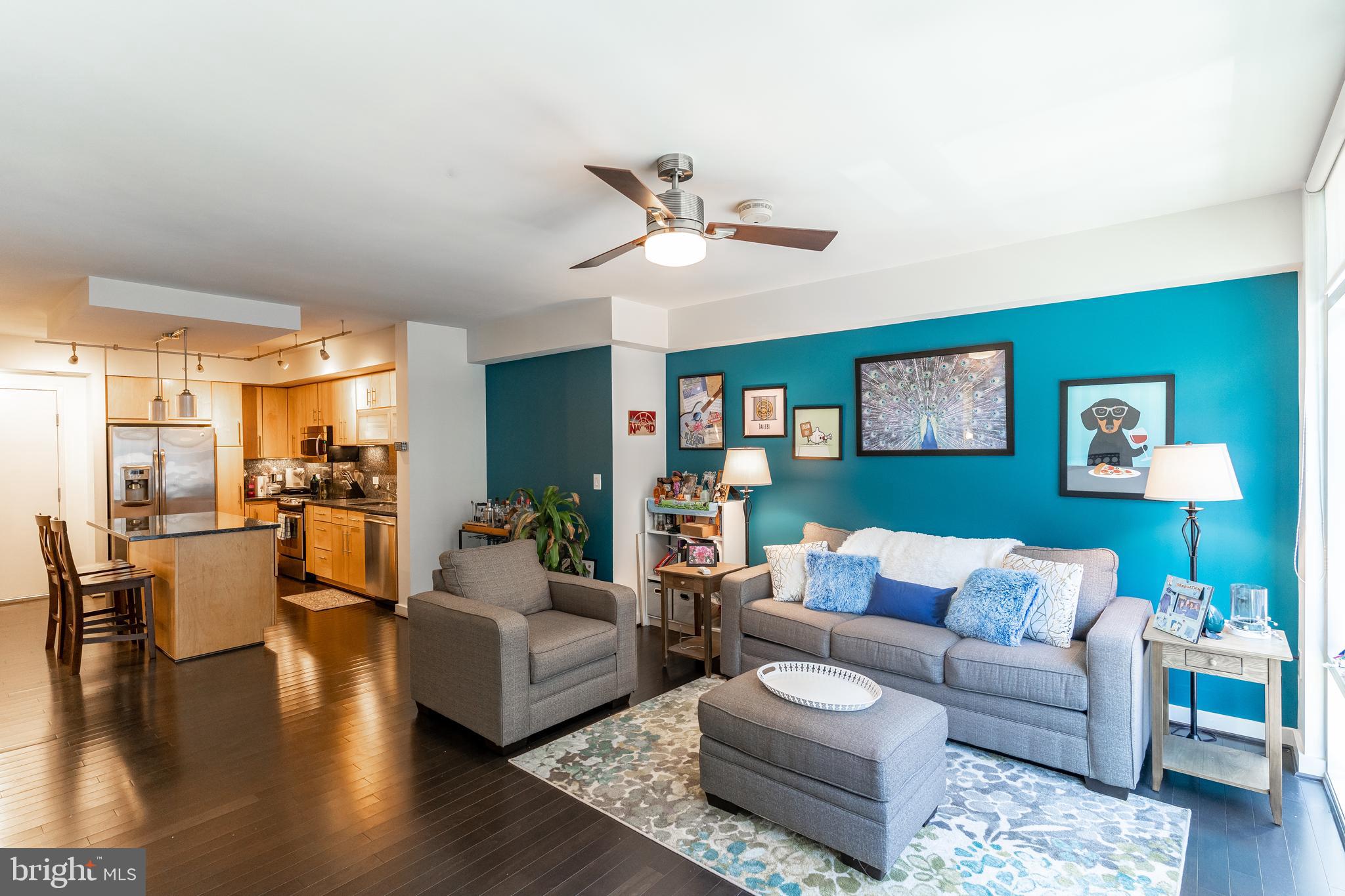 1025 First Street Southeast, Unit 514 Washington, DC 20003 - Photo 2 of 15 a living room with furniture and a wooden floor
