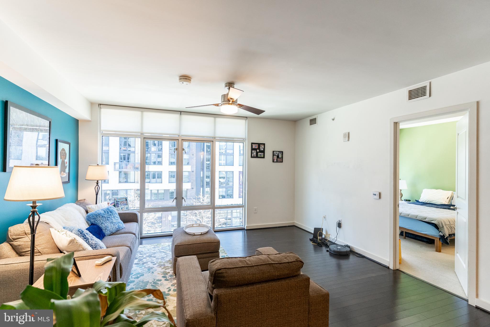 1025 First Street Southeast, Unit 514 Washington, DC 20003 - Photo 3 of 15 a living room with furniture and a large window