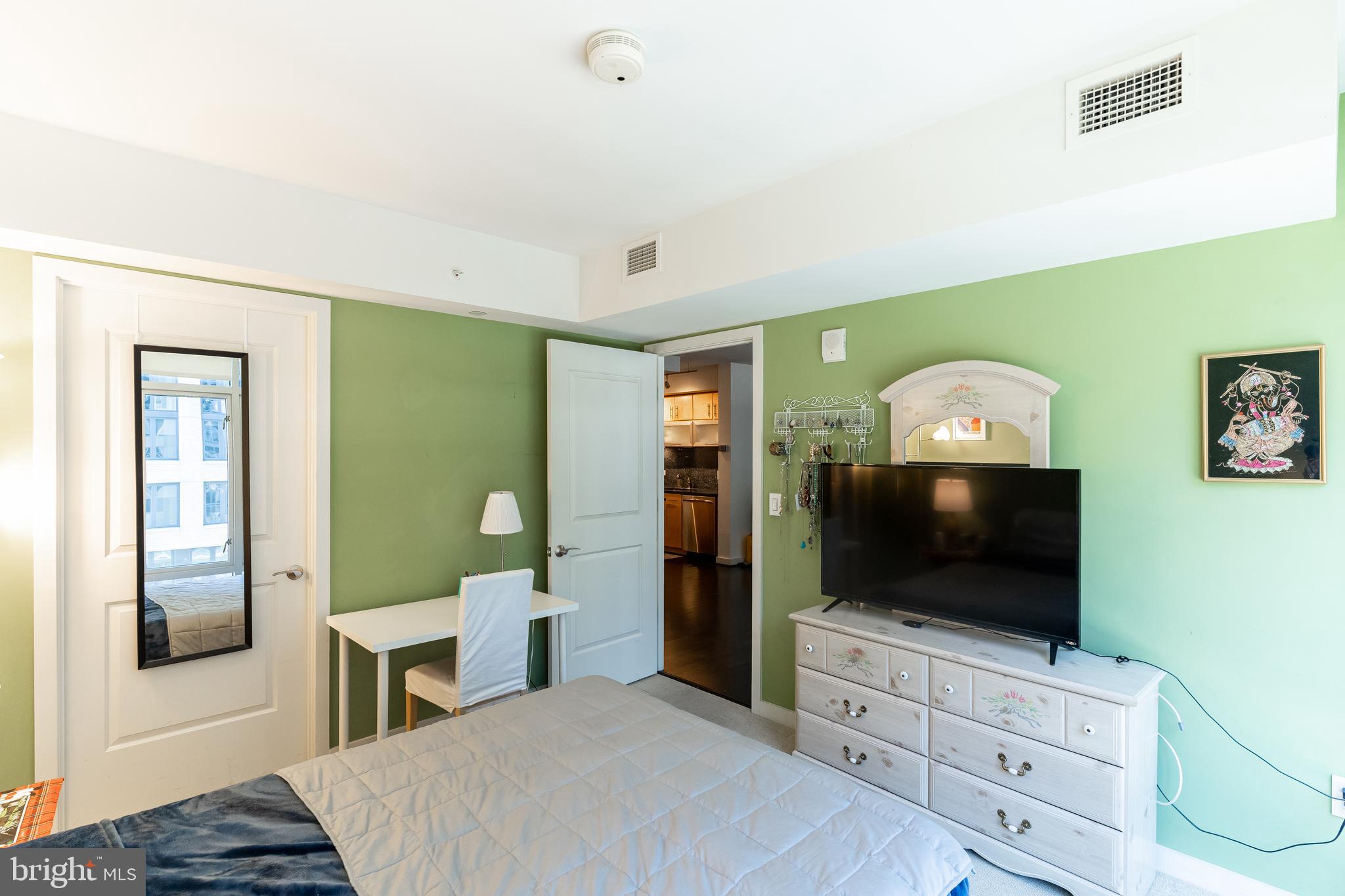 1025 First Street Southeast, Unit 514 Washington, DC 20003 - Photo 8 of 15 a living room with furniture and a flat screen tv