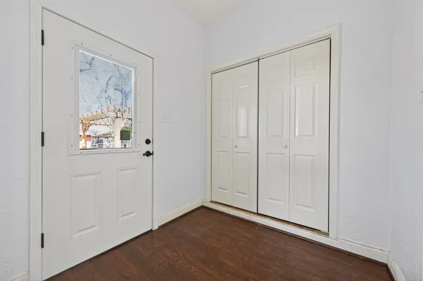 a backyard of a house with a garden and stairs