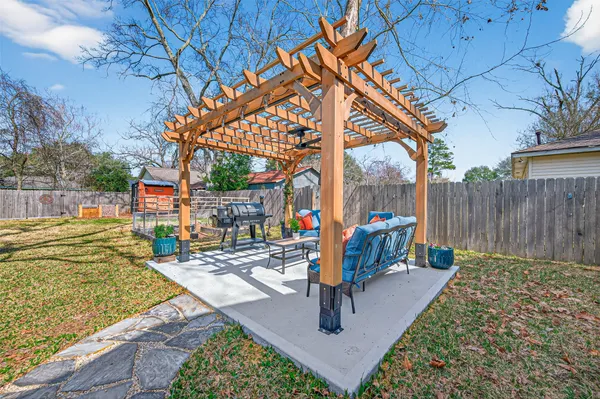 a bed sitting in a bedroom next to a lamp
