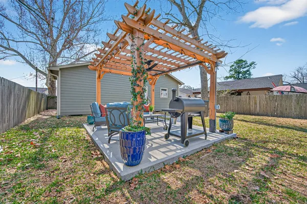 a spacious bedroom with a bed and a window