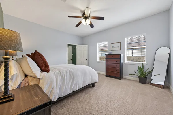 a view of a patio with table and chairs and potted plants