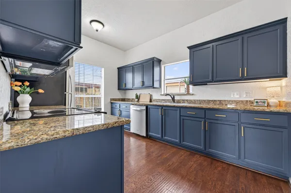 a stove top oven sitting inside of a kitchen
