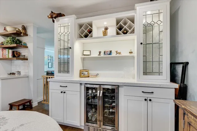 a kitchen with a refrigerator and cabinets