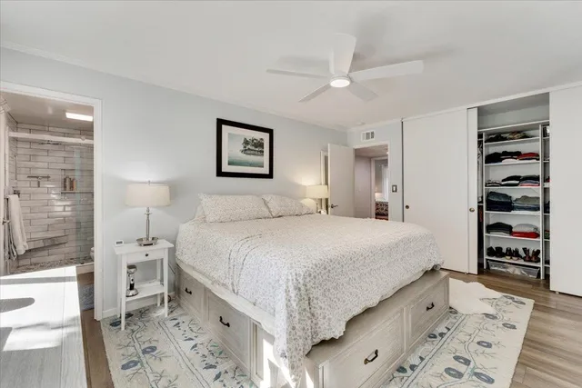 a bedroom with a bed and a walk in closet