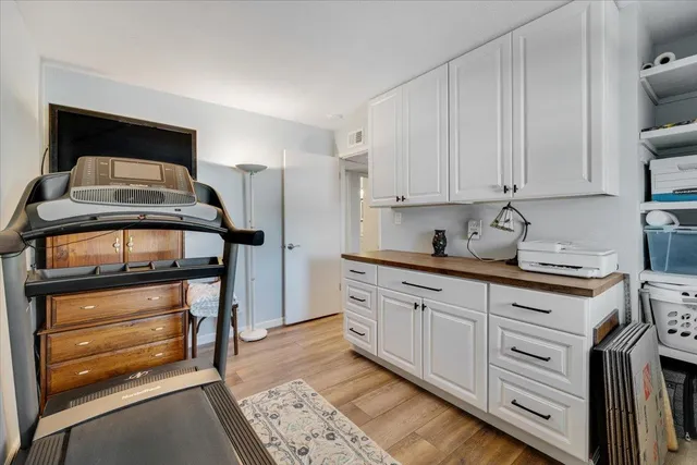 a kitchen with stainless steel appliances granite countertop a sink and cabinets