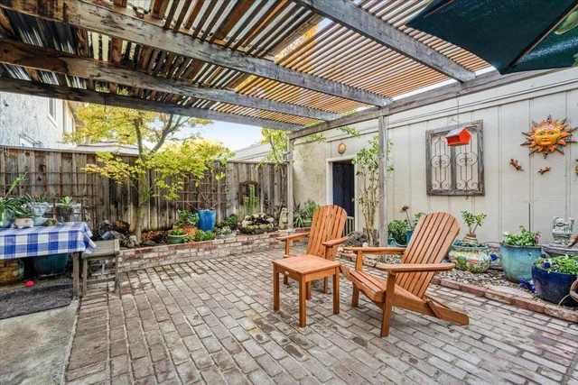 a outdoor space with patio furniture and potted plants