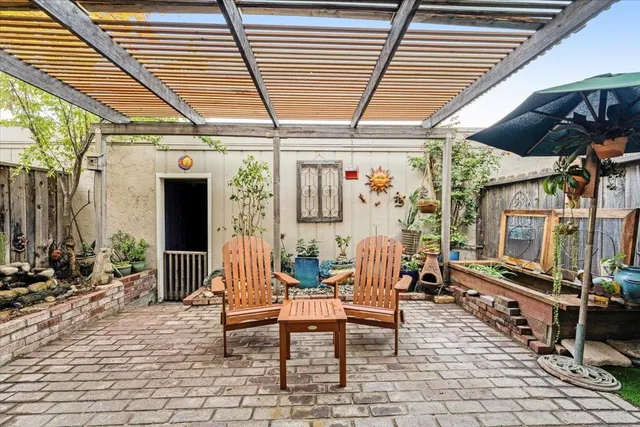a outdoor living space with patio furniture and a wooden floor