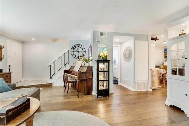a view of a livingroom with furniture and stairs