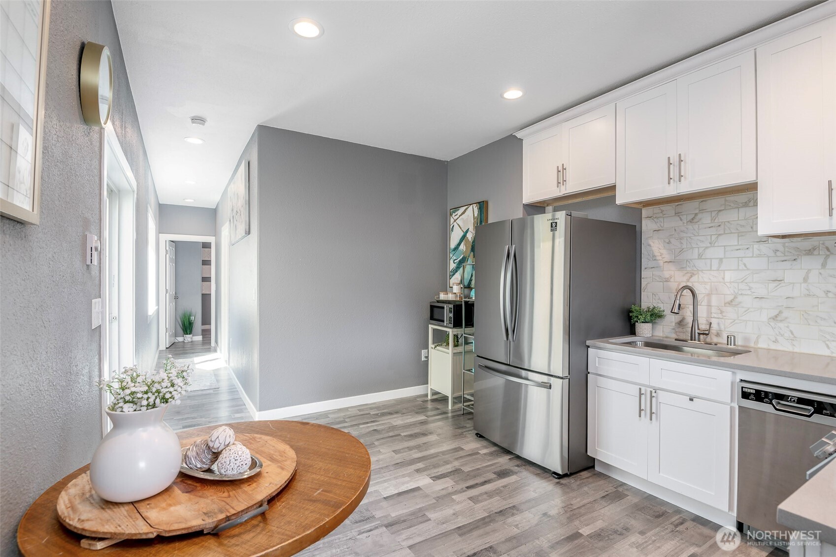 3506 South Tyler Street Tacoma, WA 98409 - Photo 16 of 32 a kitchen with stainless steel appliances a refrigerator and a stove