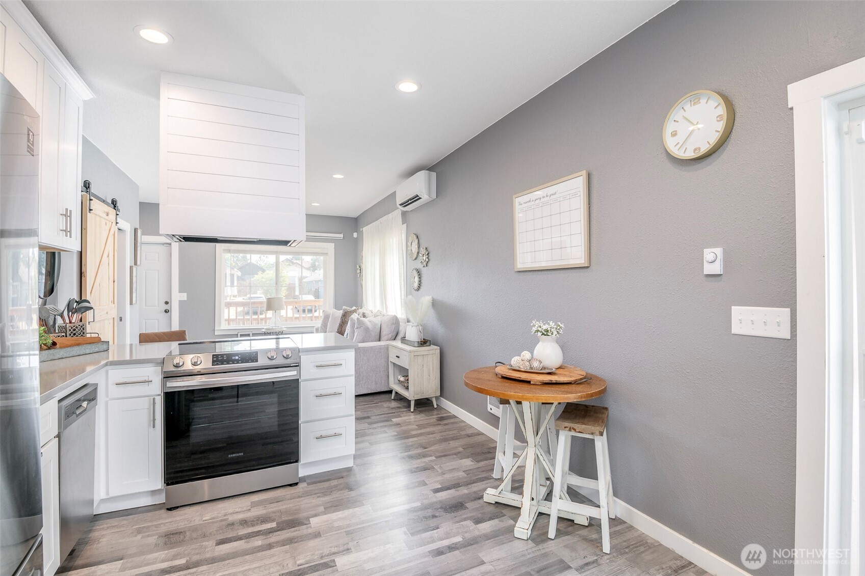 3506 South Tyler Street Tacoma, WA 98409 - Photo 17 of 32 a kitchen with stainless steel appliances a stove a chimney a sink and a refrigerator