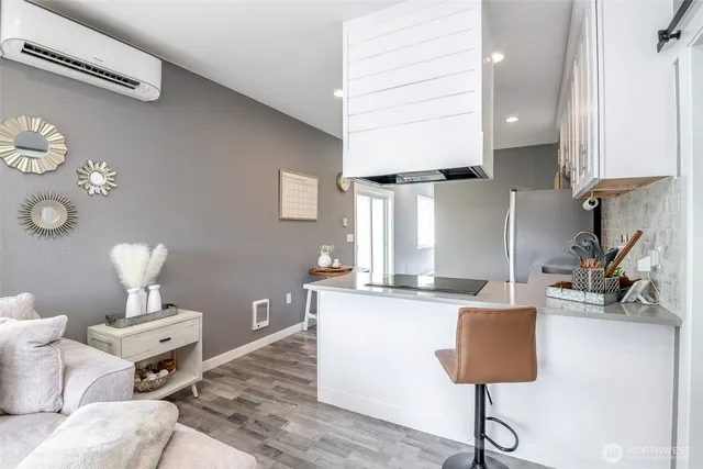 a living room with furniture and a lamp