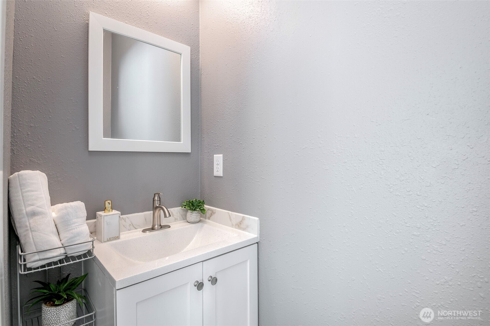 3506 South Tyler Street Tacoma, WA 98409 - Photo 29 of 32 a bathroom with a sink and a mirror