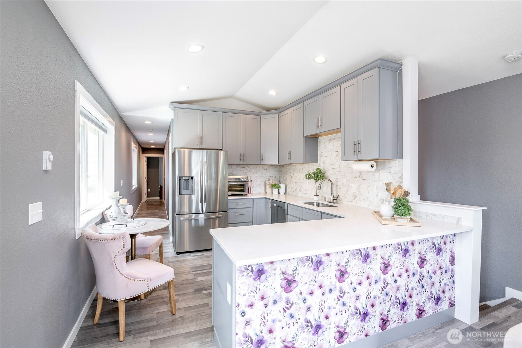 3506 South Tyler Street Tacoma, WA 98409 - Photo 6 of 32 a kitchen with granite countertop kitchen island stainless steel appliances a sink and a refrigerator