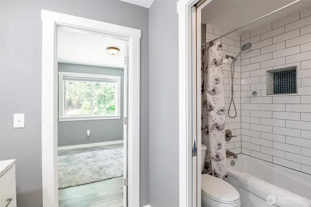 a bathroom with a toilet a sink and a shower