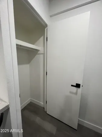 a front view of a building with parking area