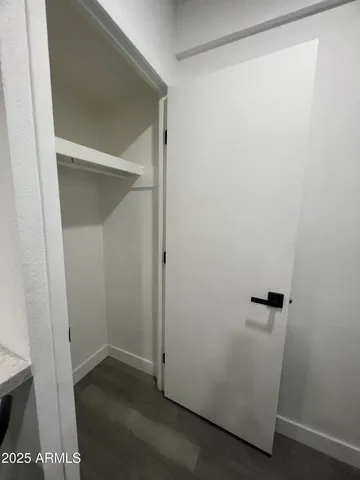 a front view of a building with parking area