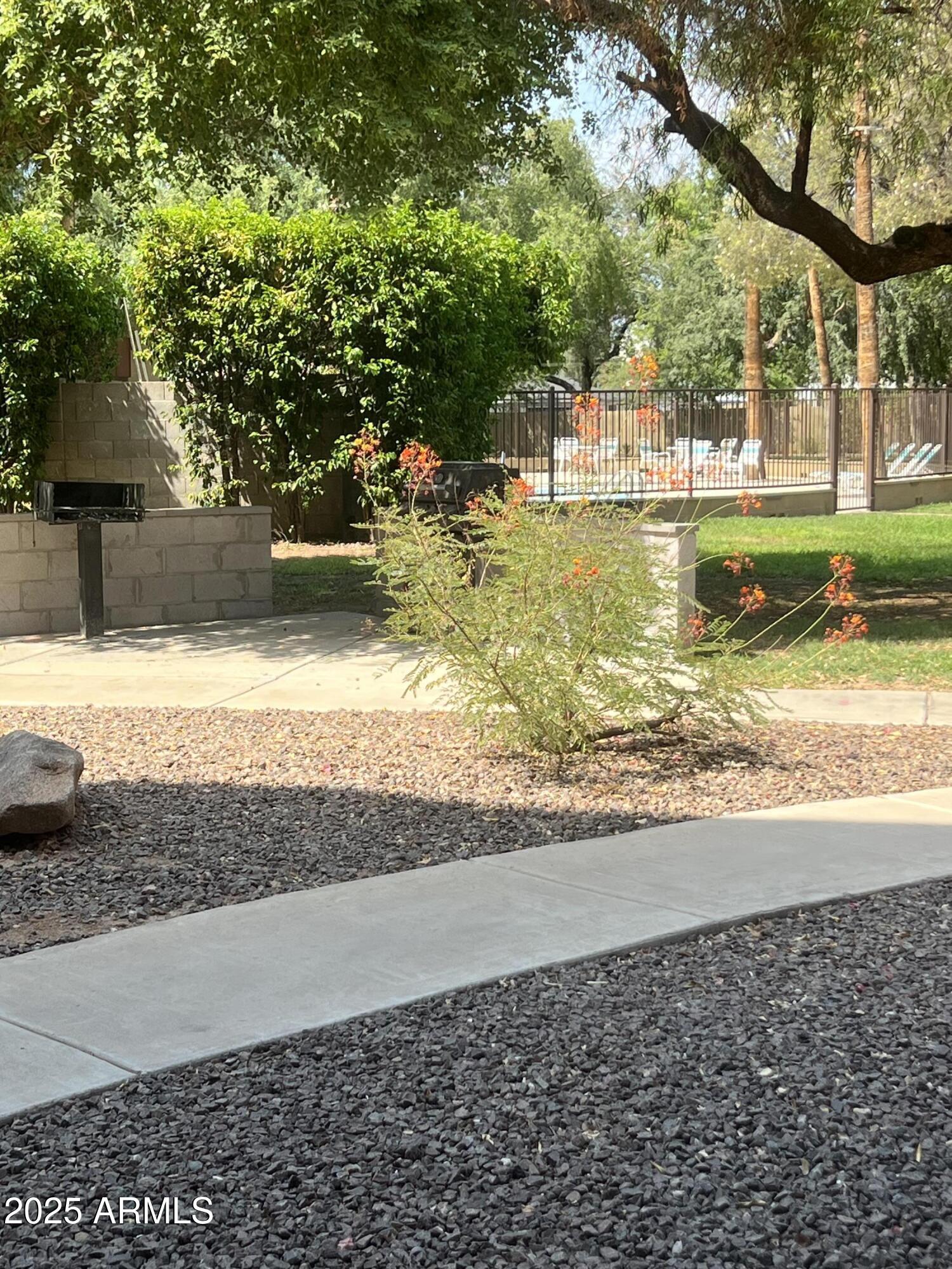 353 East Thomas Road, Unit C104 Phoenix, AZ 85012 - Photo 5 of 17 a view of a yard with an outdoor space