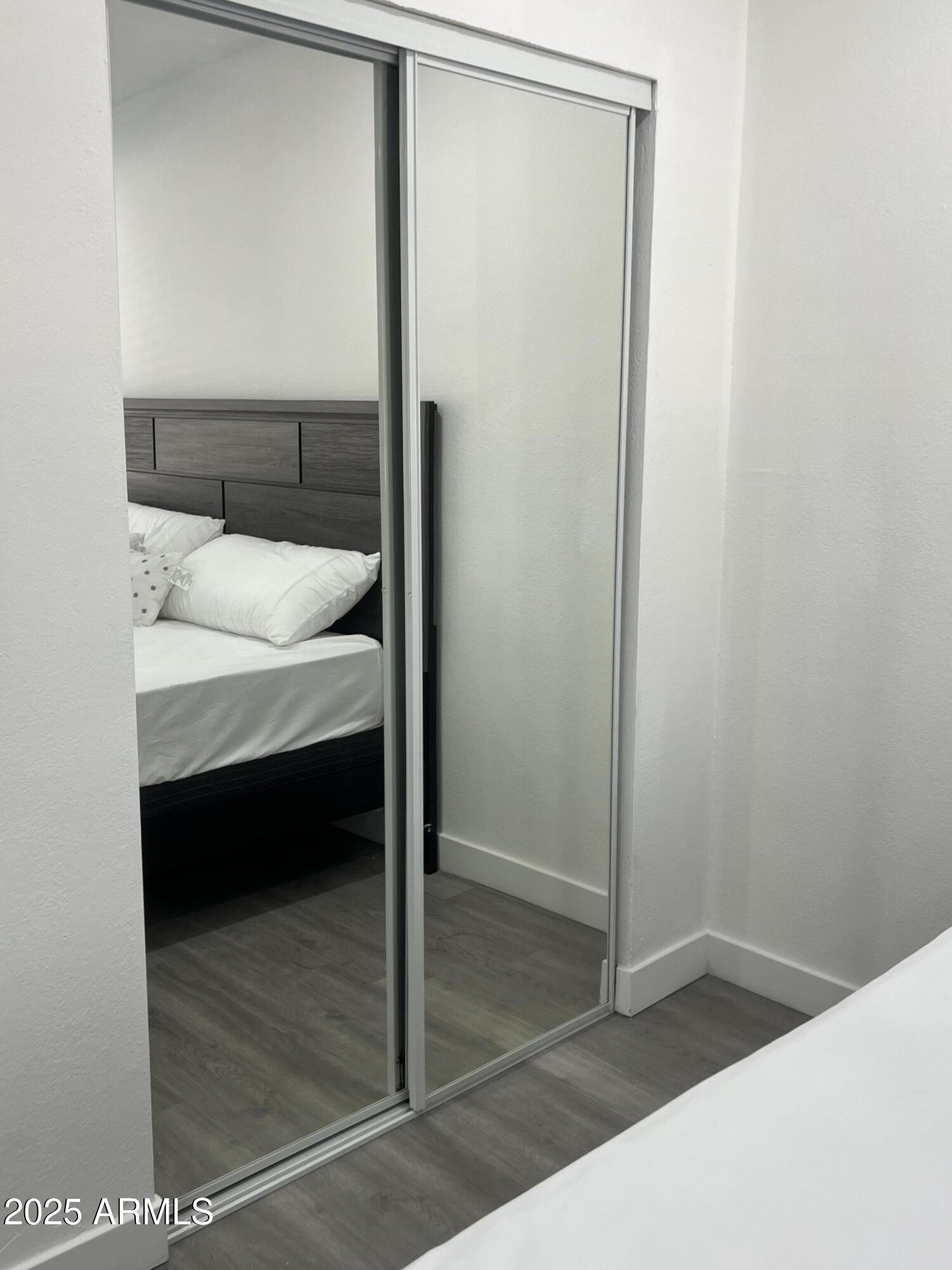 353 East Thomas Road, Unit C104 Phoenix, AZ 85012 - Photo 9 of 17 a bathroom with a sink and a mirror