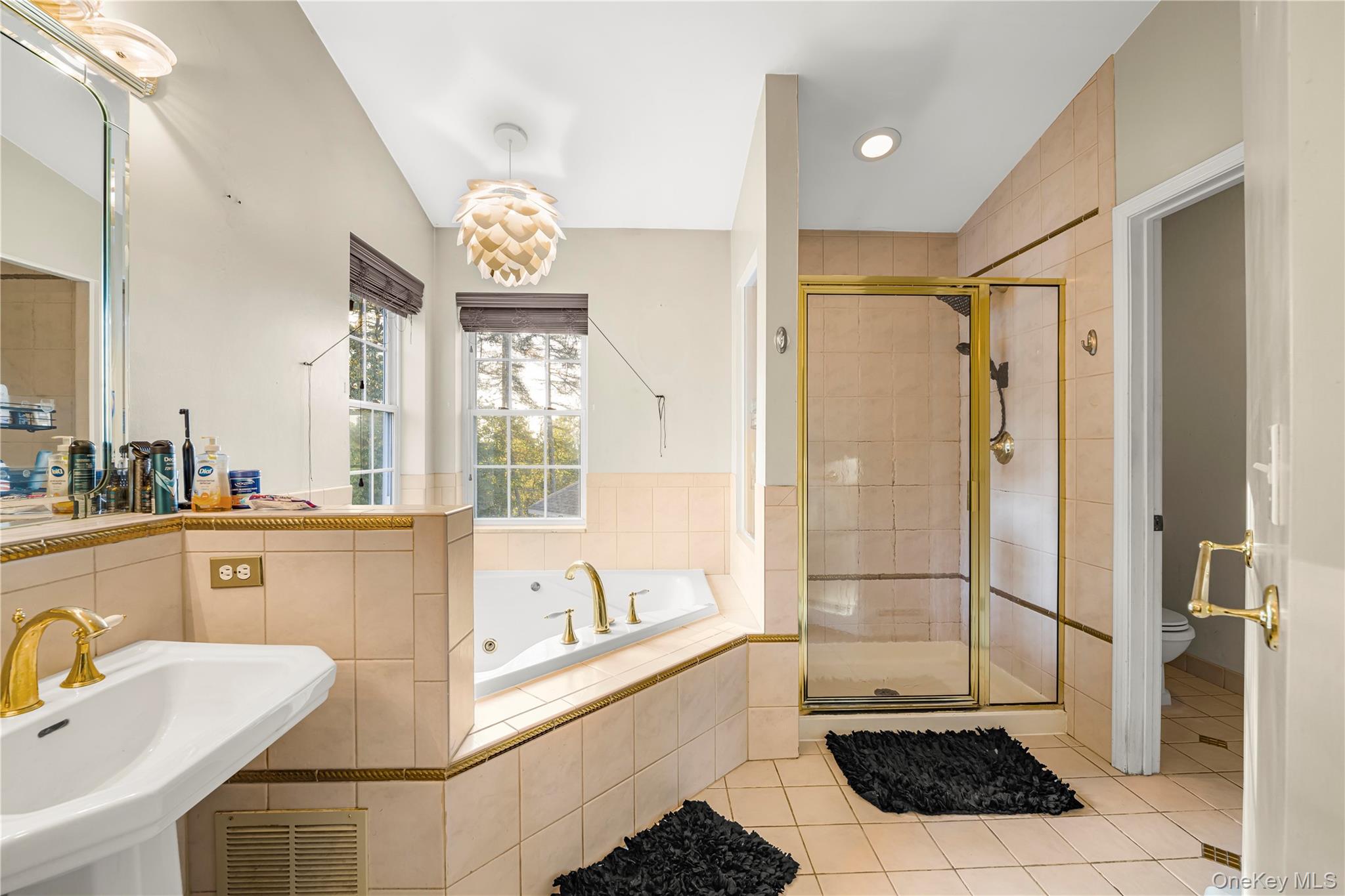 17 Brendella Court Wallkill, NY 12589 - Photo 13 of 39 Full bathroom featuring light tile patterned floors, a shower stall, a bath, and recessed lighting